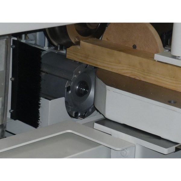 Wooden plank being processed in the Pentho Compact 4 Tenoner